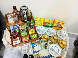 a table with a bunch of food on it at Gadou Rooms -Private & Shared Stays in Port Said Best Location in Port Said