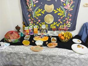 a table topped with food and bowls of food at Gadou Rooms -Private & Shared Stays in Port Said Best Location in Port Said
