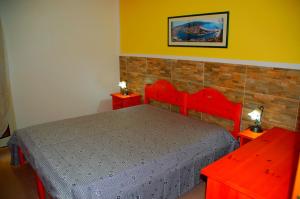Ένα ή περισσότερα κρεβάτια σε δωμάτιο στο Turas Club Case Vacanze