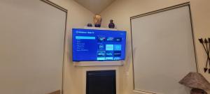 a flat screen tv on a wall in a room at Moab Adventure Basecamp in Moab