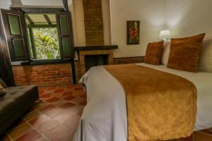Postel nebo postele na pokoji v ubytování Hotel Vísperas