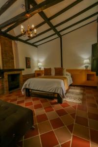 Postel nebo postele na pokoji v ubytování Hotel Vísperas