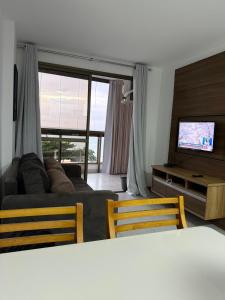 Et tv og/eller underholdning på Paradise facing the sea - praia dourada