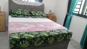 a bedroom with a bed with at KAMI roomstay in Guar Chempedak