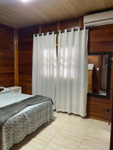 Postel nebo postele na pokoji v ubytování Casa em Penha - Armação-Itapocoroy + 14 fotografií