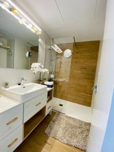 a bathroom with a sink and a shower at BEST CALACEITE SUNSET VIEWS in Torrox Costa