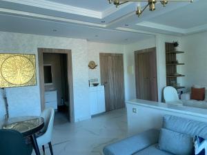 a living room with a couch and a table at Résedence Puerta del mar Malabata in Tangier