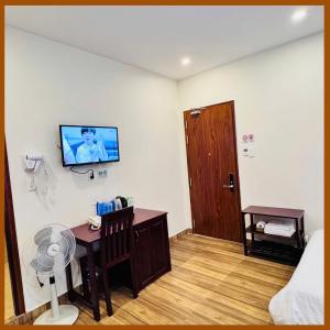 TV a/nebo společenská místnost v ubytování Nam Xuan Premium Hotel