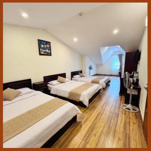 Postel nebo postele na pokoji v ubytování Nam Xuan Premium Hotel