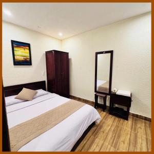 Postel nebo postele na pokoji v ubytování Nam Xuan Premium Hotel