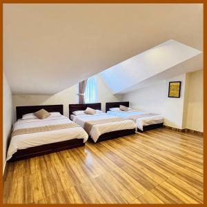 Postel nebo postele na pokoji v ubytování Nam Xuan Premium Hotel