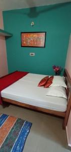 Postel nebo postele na pokoji v ubytování Nakshatra Homestay