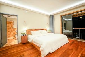 Katil atau katil-katil dalam bilik di Xianxiuju Garden Courtyard B&B