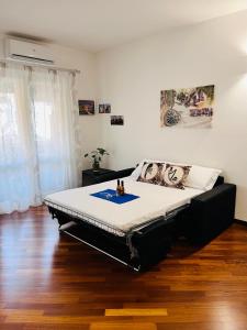 a bedroom with a large bed in a room at Michi House Appartamento in centro a Palermo in Palermo