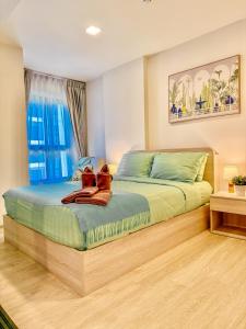 Ένα ή περισσότερα κρεβάτια σε δωμάτιο στο Cabanas huahin +55 φωτογραφίες