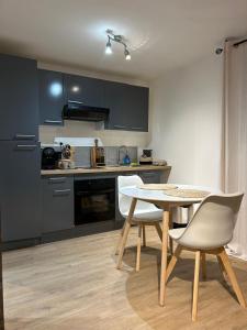 a kitchen with a table and chairs in a room at Casa CARLU-MARIA IV in Corte