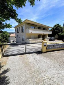 a house with a fence in front of it at Casa CARLU-MARIA IV in Corte