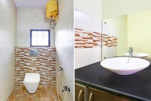 a bathroom with a sink and a toilet at Super Hotel O Near Dilsuknagar Metro in Hyderabad