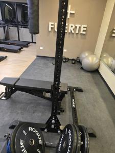a gym with a squat rack and weights at Apartment in Torre Artemisa in Tegucigalpa