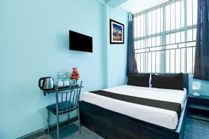 Postel nebo postele na pokoji v ubytování Hotel O Bhubaneshwar Near ITER College
