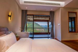 Katil atau katil-katil dalam bilik di Xianxiuju Garden Courtyard B&B