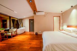 Katil atau katil-katil dalam bilik di Xianxiuju Garden Courtyard B&B