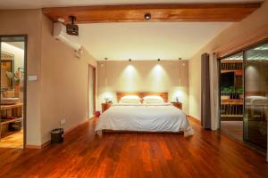 Katil atau katil-katil dalam bilik di Xianxiuju Garden Courtyard B&B