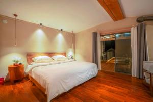 Katil atau katil-katil dalam bilik di Xianxiuju Garden Courtyard B&B