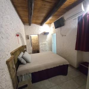 Posteľ alebo postele v izbe v ubytovaní La Grotta