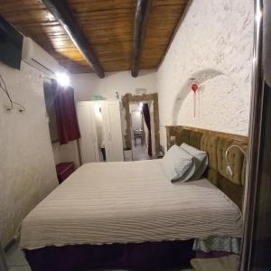 Posteľ alebo postele v izbe v ubytovaní La Grotta