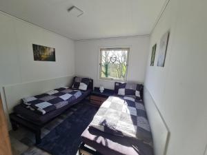 Postel nebo postele na pokoji v ubytování Ferienhaus am Waldrand auf der "Gübyer Alm"