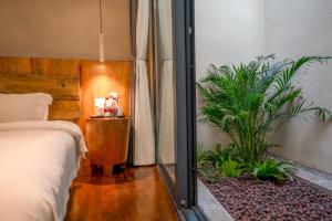 Katil atau katil-katil dalam bilik di Xianxiuju Garden Courtyard B&B