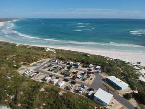 an aerial view of a parking lot next to the beach at Experience Lancelin Holiday Park in Lancelin