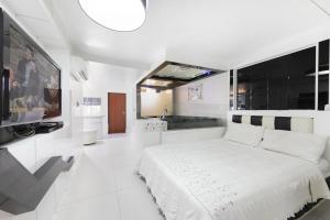 En eller flere senge i et værelse på Gapyeong Belita pension