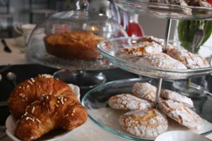 a display of pastries and pastries on a table at B&B Montecarlo in Palermo