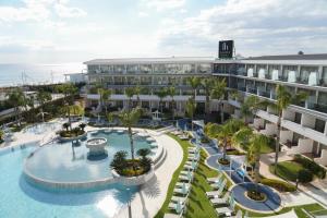 an aerial view of a resort with a swimming pool at Faros Hotel Ayia Napa in Ayia Napa