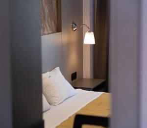 Ένα ή περισσότερα κρεβάτια σε δωμάτιο στο Hotel Dionysos Polichrono