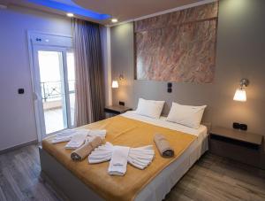 Ένα ή περισσότερα κρεβάτια σε δωμάτιο στο Hotel Dionysos Polichrono