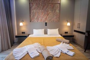 Ένα ή περισσότερα κρεβάτια σε δωμάτιο στο Hotel Dionysos Polichrono