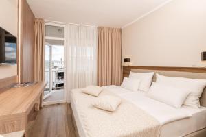 TV a/nebo společenská místnost v ubytování Hotel Malin