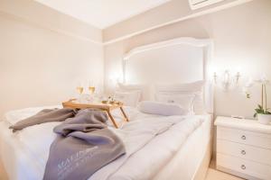 Postel nebo postele na pokoji v ubytování Hotel Malin