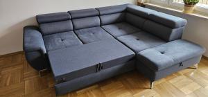 a blue couch and stool in a living room at Apartament Gdynia Babie Doły in Gdynia