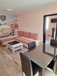 a living room with a couch and a table at Palma in Burgas City