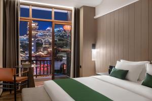 Katil atau katil-katil dalam bilik di Yinmo Hotel +28 gambar