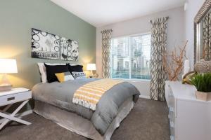 a bedroom with a large bed and a window at 300 Railway in Campbell