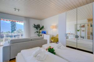 Ένα ή περισσότερα κρεβάτια σε δωμάτιο στο Casa Miramonti - Happy Rentals