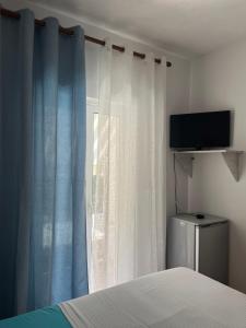 TV a/nebo společenská místnost v ubytování Hotel Portokali