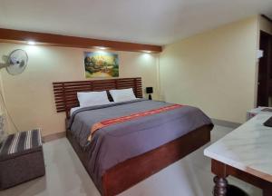 Ένα ή περισσότερα κρεβάτια σε δωμάτιο στο The Windsor Boutique Resort