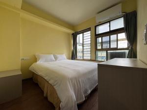 Postel nebo postele na pokoji v ubytování 慢且洄瀾文旅 Bantshiann Hualie Hotel