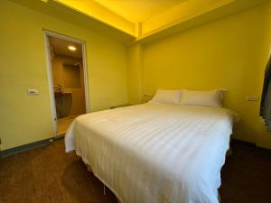 Postel nebo postele na pokoji v ubytování 慢且洄瀾文旅 Bantshiann Hualie Hotel